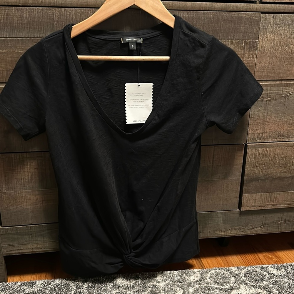 Stella & dot black sweatshirt - small NWT . Knit detail at bottom center